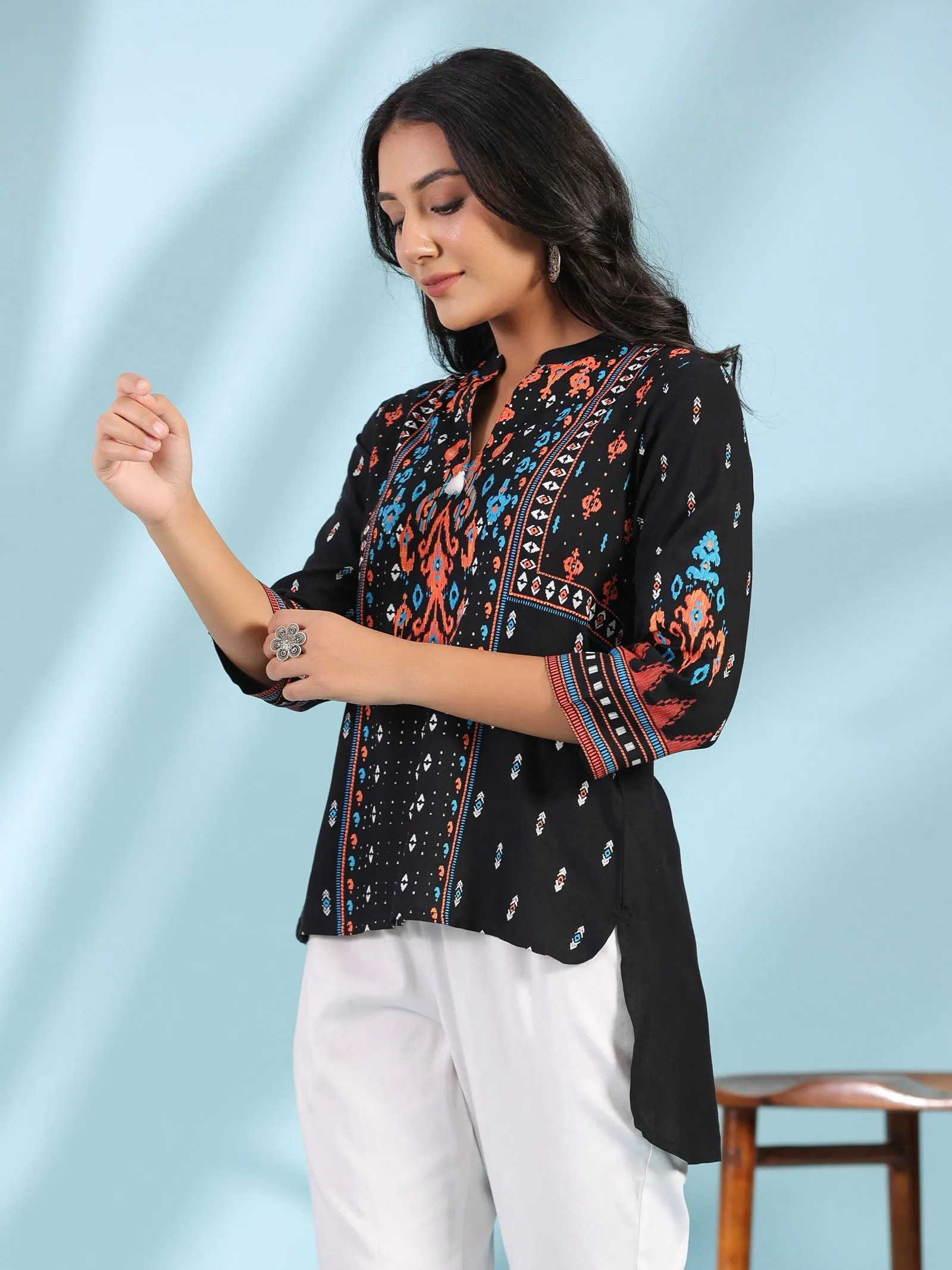 Jashvi Black Rayon Ikat Placement Printed High-Low Tunic With Side Slits & Tassels