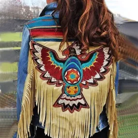 Thunderbird Print Jean Jacket Tan Vegan Leather Fringe With Fringed Sleeves Denim Coat With Colorful Eagle On Back Available In Sizes Small Medium Large XL And Plus Size 2X XXL